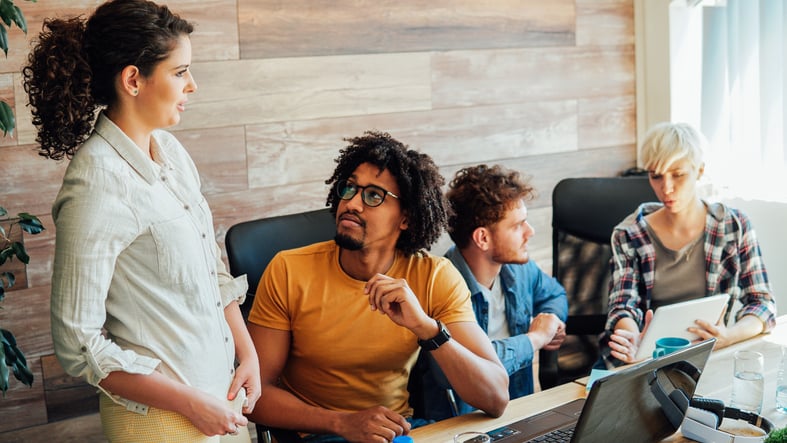 millennials working together around a table