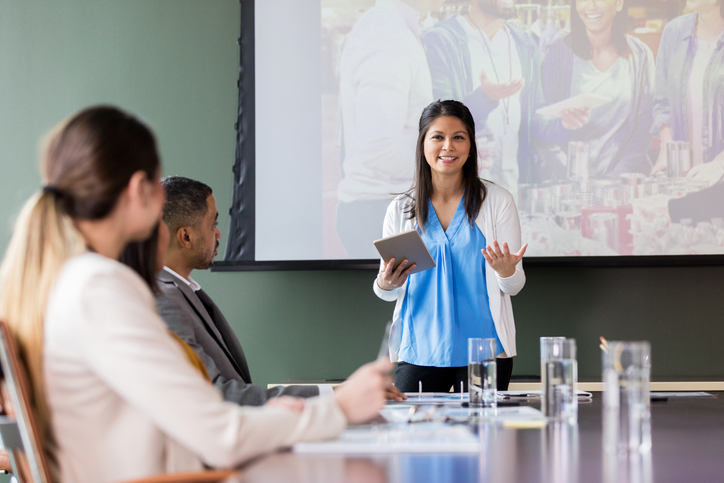 woman speaking in a meeting about grants for her nonprofit