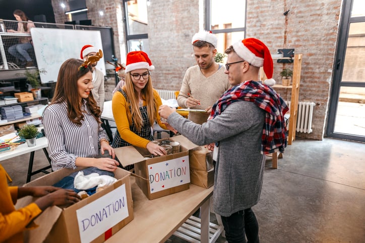 people sorting through donations for year-end giving