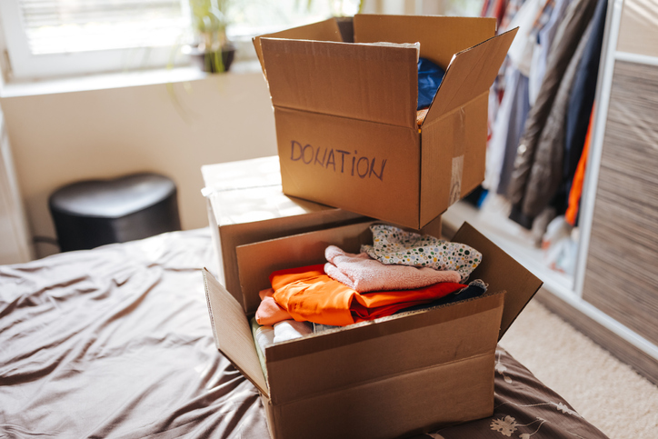 stack of boxes with clothes and noncash donations