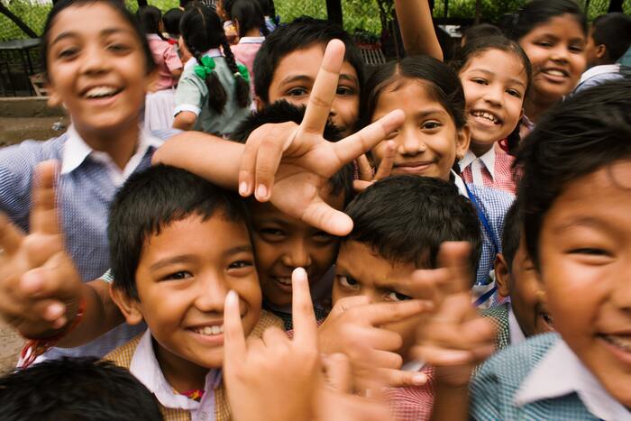 group of kids smiling toward the camera